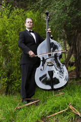 man playing the double bass in park