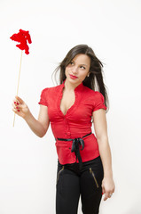 Gorgeous girl in red holding cupid wand, Valentines day