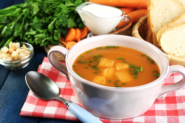 Composition with carrot soup, ingredients and herbs