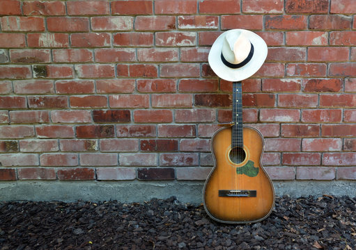 Musician Takes a Break - Guitar, Harp and Panama Hat