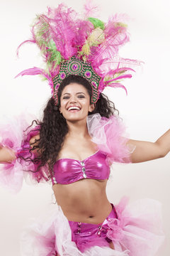 Gorgeous samba dancer wearing traditional pink costume