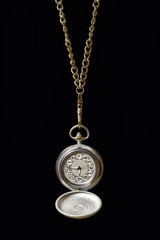 Pocket watch on a long chain.