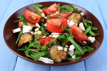 Eggplant salad with tomatoes, arugula and feta cheese,