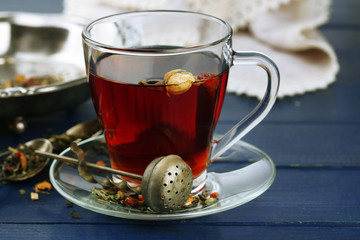 Beautiful vintage composition with herbal tea, on wooden table
