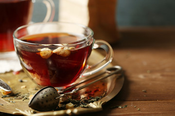 Beautiful vintage composition with herbal tea, on wooden table