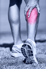 Muscle injury - Man running clutching calf muscle