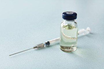 Vaccine in vial with syringe