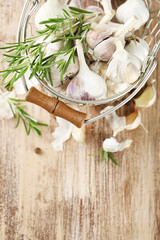 Raw garlic and spices on wooden table