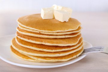 Fototapeta na wymiar Stack of delicious pancakes with butter