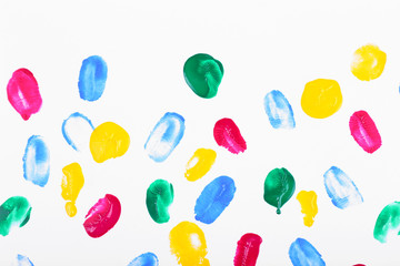 Colorful paint strokes on sheet of paper background