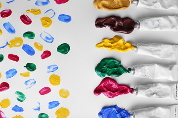 Colorful paint strokes on sheet of paper background