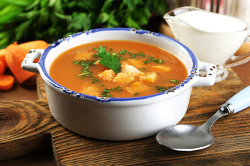 Composition with carrot soup, ingredients and herbs