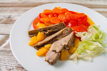 Duck fillet with orange and vegetables