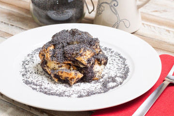 Poppy seed dumps on white plate. Hungarian traditional dessert.