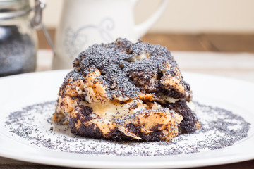 Hungarian traditional  poppy seed dumps on white plate