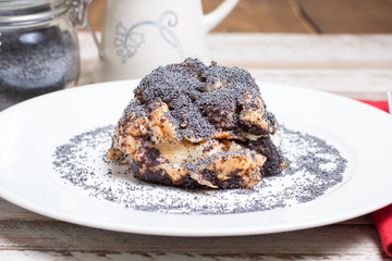 Poppy seed dumps on white plate. Hungarian traditional dessert.