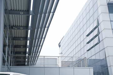 outside of a modern industrial building with stained glass windo