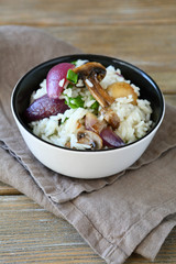 Tasty rice with mushrooms and onions