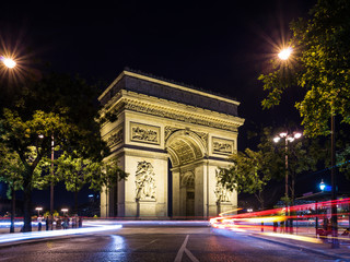 Arch of Triumph (Arc de Triomphe) at night with light trails