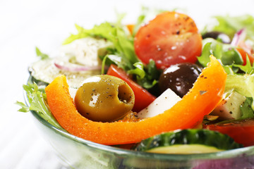Greek salad in glass dish, closeup
