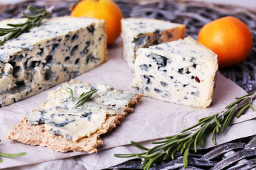 Blue cheese with sprigs of rosemary and oranges