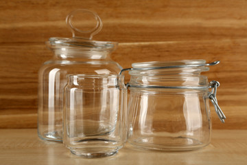 Set of empty glassware on wooden background