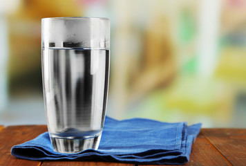 Glass of ice water with napkin