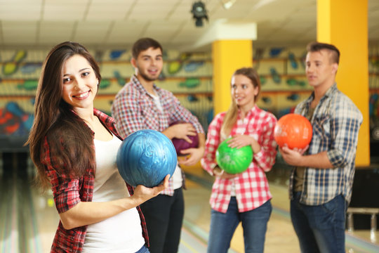 Portrait of friends in bowling club
