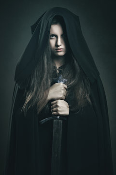 Beautiful Dark Woman With Black Robe And Sword