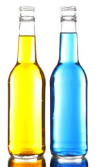 Colorful alcoholic beverages in glass bottles isolated on white