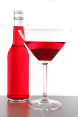Colorful alcoholic beverages in glassware isolated on white