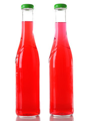 Colorful alcoholic beverages in glass bottles isolated on white