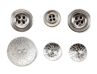 Grey sewing buttons isolated on white