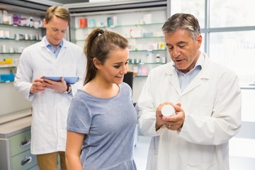 Happy customer talking with pharmacist