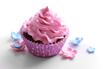 Delicious cupcake isolated on white