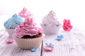 Delicious cupcakes on table close-up