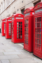 Traditional red telephone booths in London - 75987298