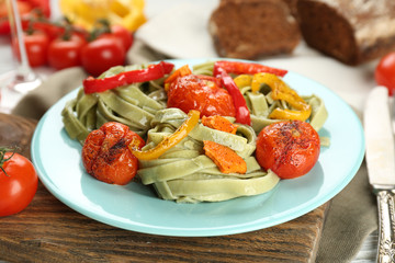 Tasty pasta with pepper, carrot and tomatoes