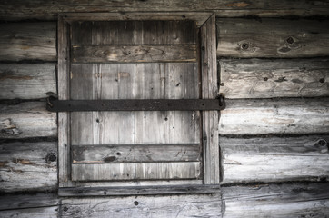 Old wooden window shutters closed, close-up