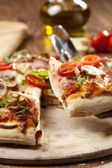 Pizza with ham and mushrooms