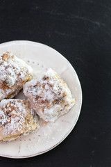 cookies on dish on black background