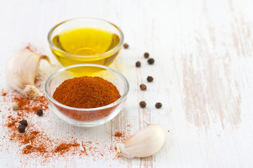 pepper with oil in bowls and garlic