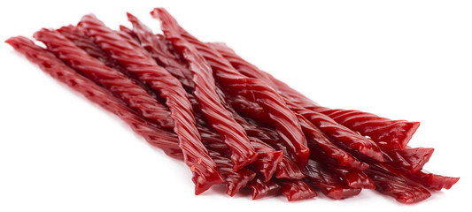 Red licorice candy shaped like a twisted rope isolated.