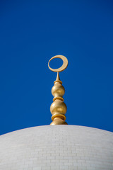 Fototapeta na wymiar Arabic Crescent on the top of a dome