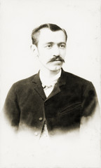 Old Portrait of a man. Made in a studio. Vintage. Year 1890