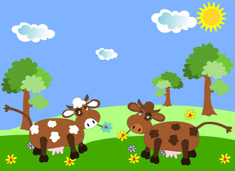 Obraz na płótnie Canvas Cows grazing on a green meadow