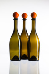 Empty three  wine bottles and golf balls