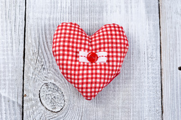 Heart on white wood background