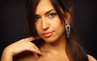 Fototapeta premium Beautiful young woman portrait. Jewelry and diamonds
