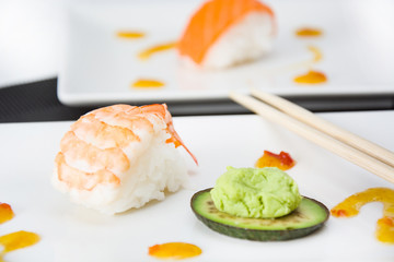 sushi and wasabi with soy sauce